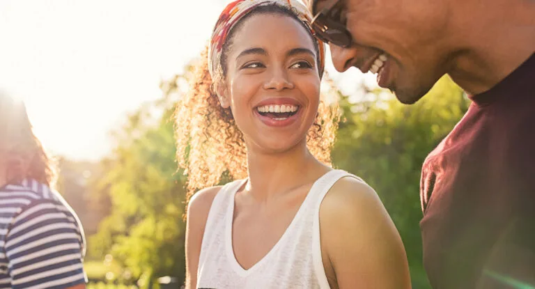 Cheerful woman holding a smartphone